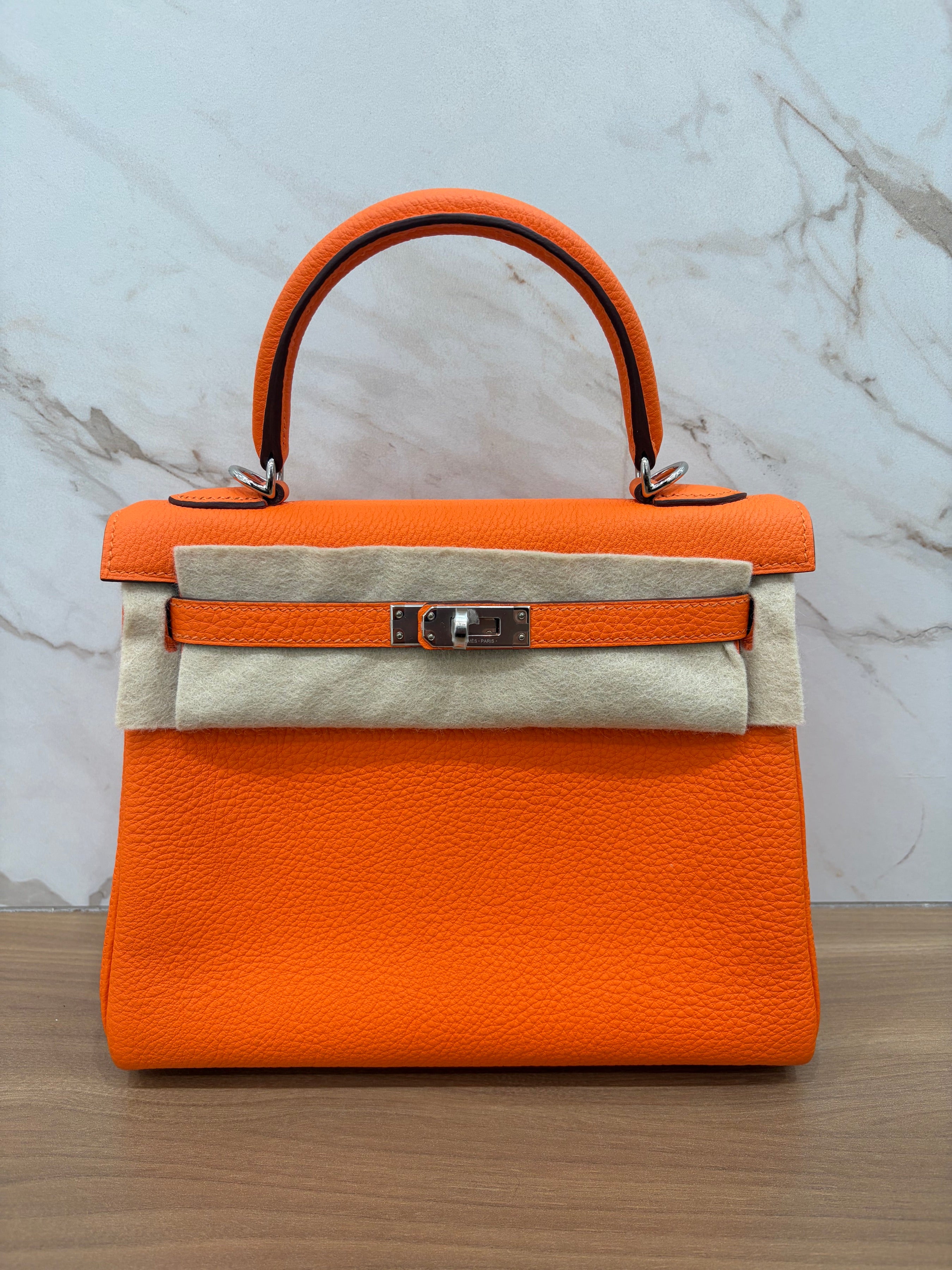 N/A Kelly 25 Orange Togo Leather PHW 2024